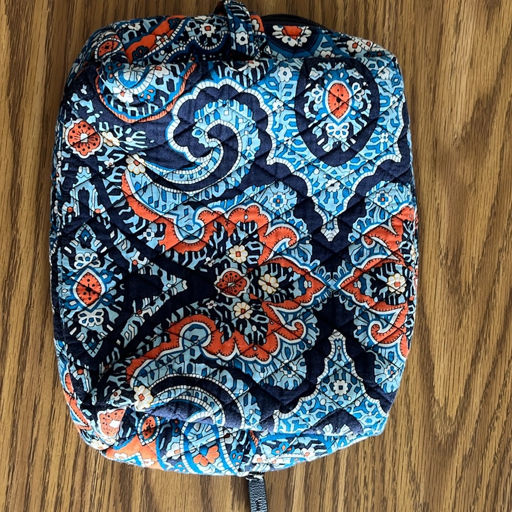 Blue and orange pattern Vera Bradley cosmetic bag.